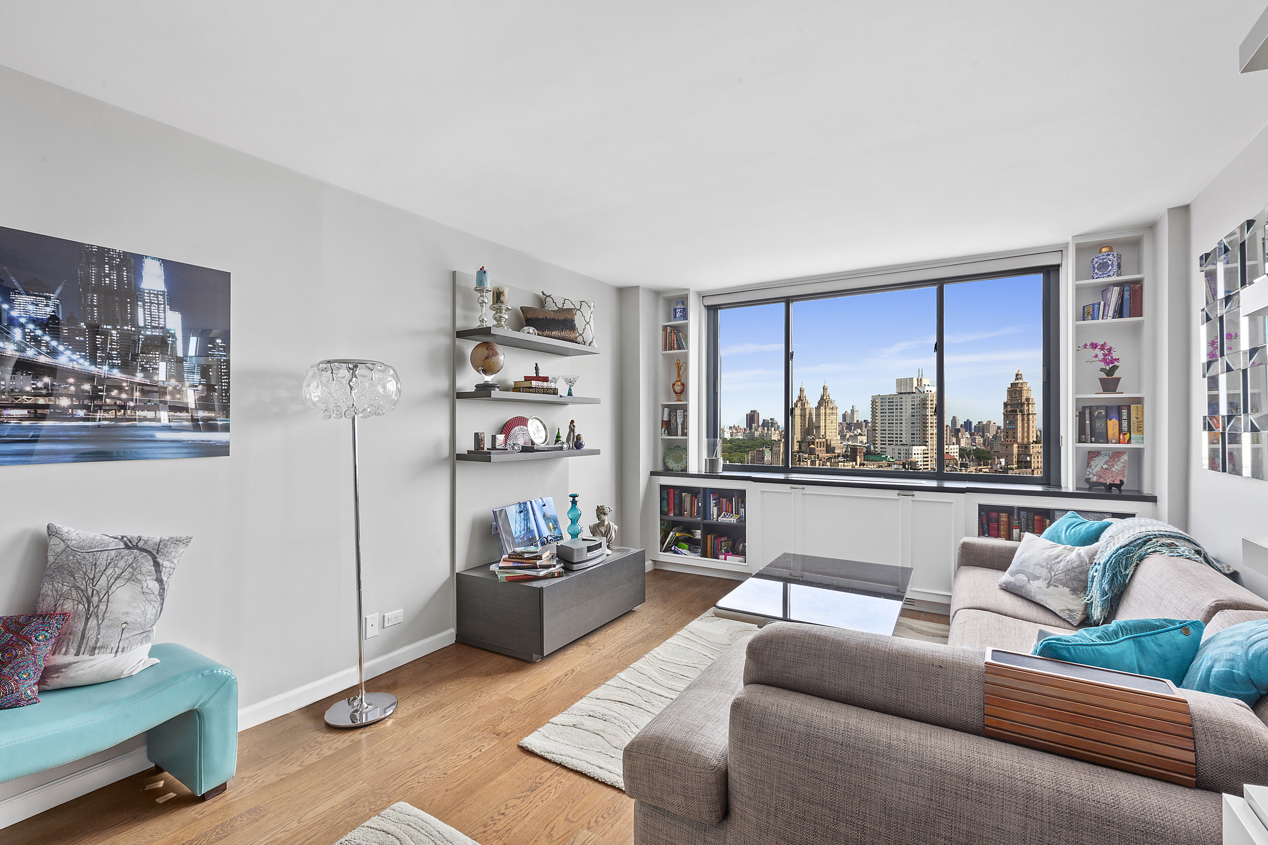2025 Broadway, Unit 29G Manhattan, NY 10023 - Photo 1 of 10 a living room with furniture and a large window