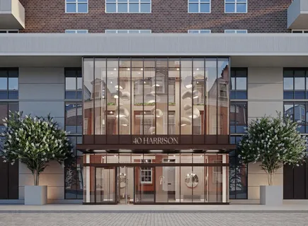 a front view of a building with potted plants