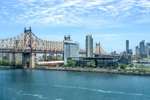 a view of a lake with a city skyline in the background