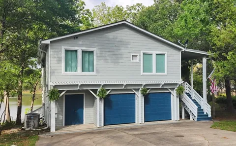 a front view of house along with street