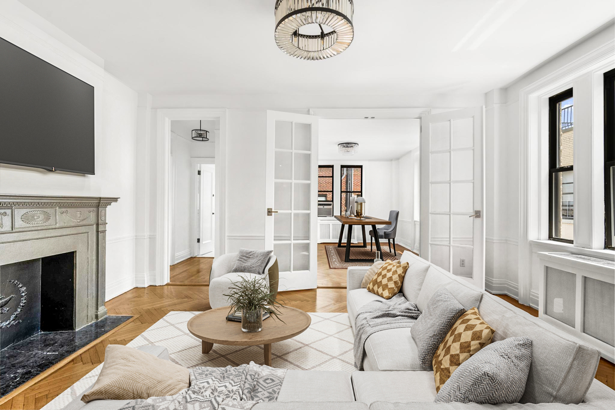 885 West End Avenue, Unit 12D Manhattan, NY 10025 - Photo 3 of 24 a living room with furniture a fireplace and a flat screen tv