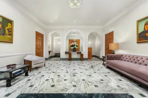 a living room with a couch and a dresser