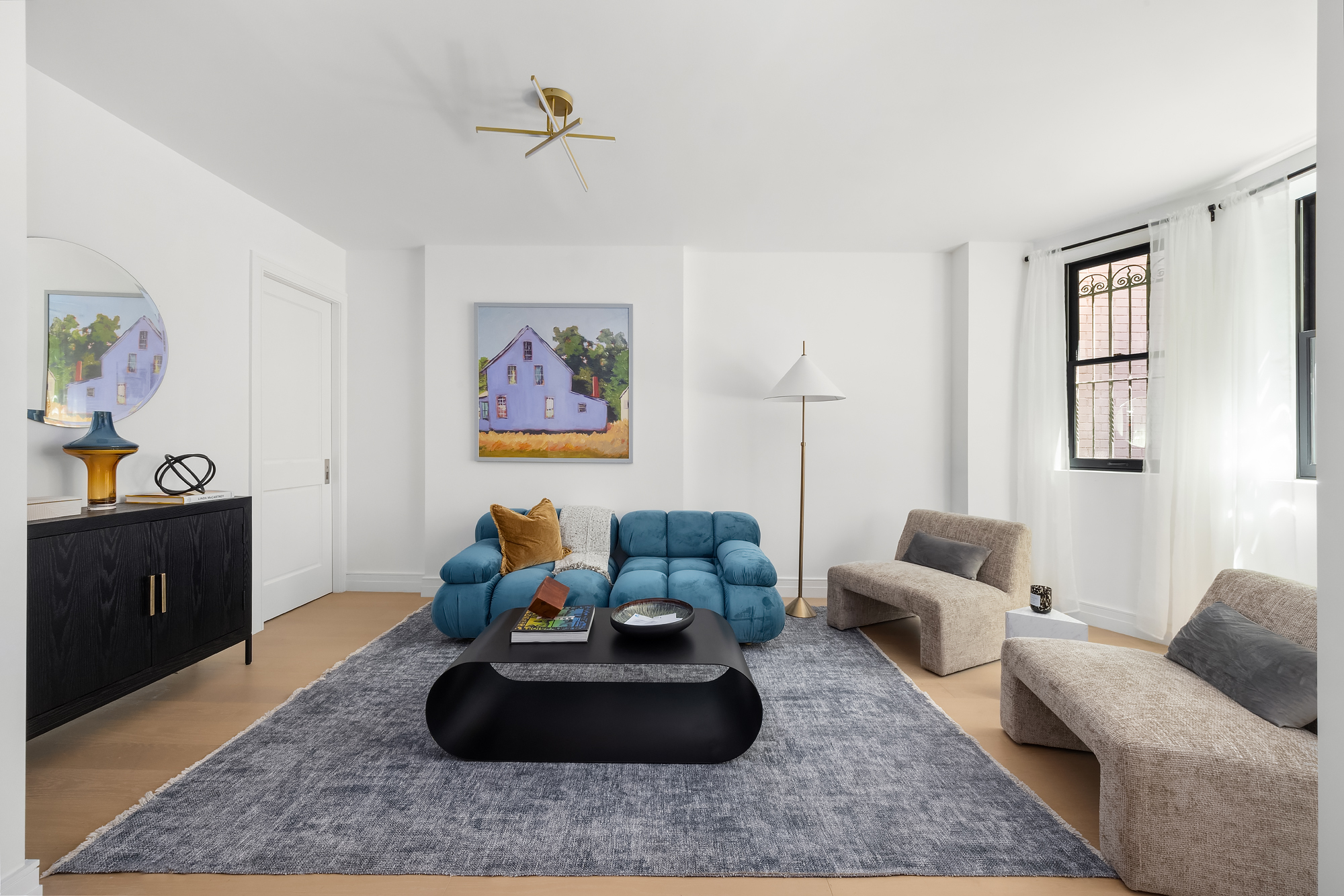 53 West 85th Street Manhattan, NY 10024 - Photo 27 of 37 a living room with furniture and a couch