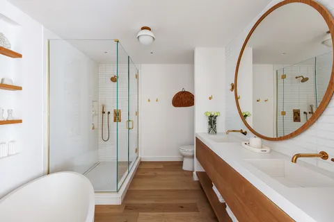 a bathroom with a tub sink and toilet