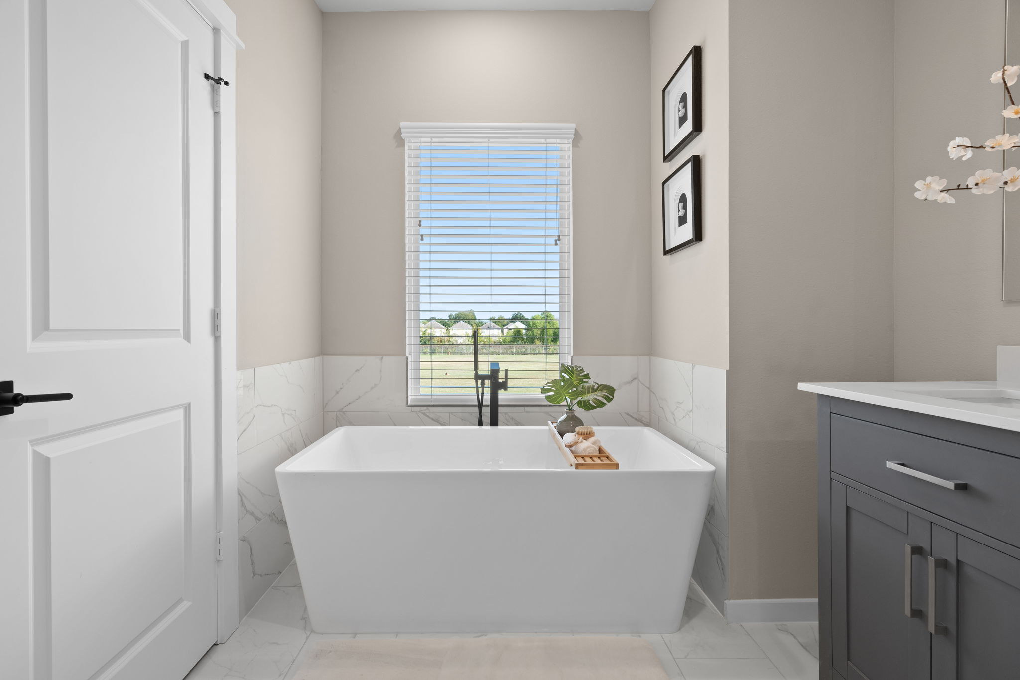 11303 Stonework Grv Lane Houston, TX 77076 - Photo 27 of 39 a white bath tub sitting in a bathroom