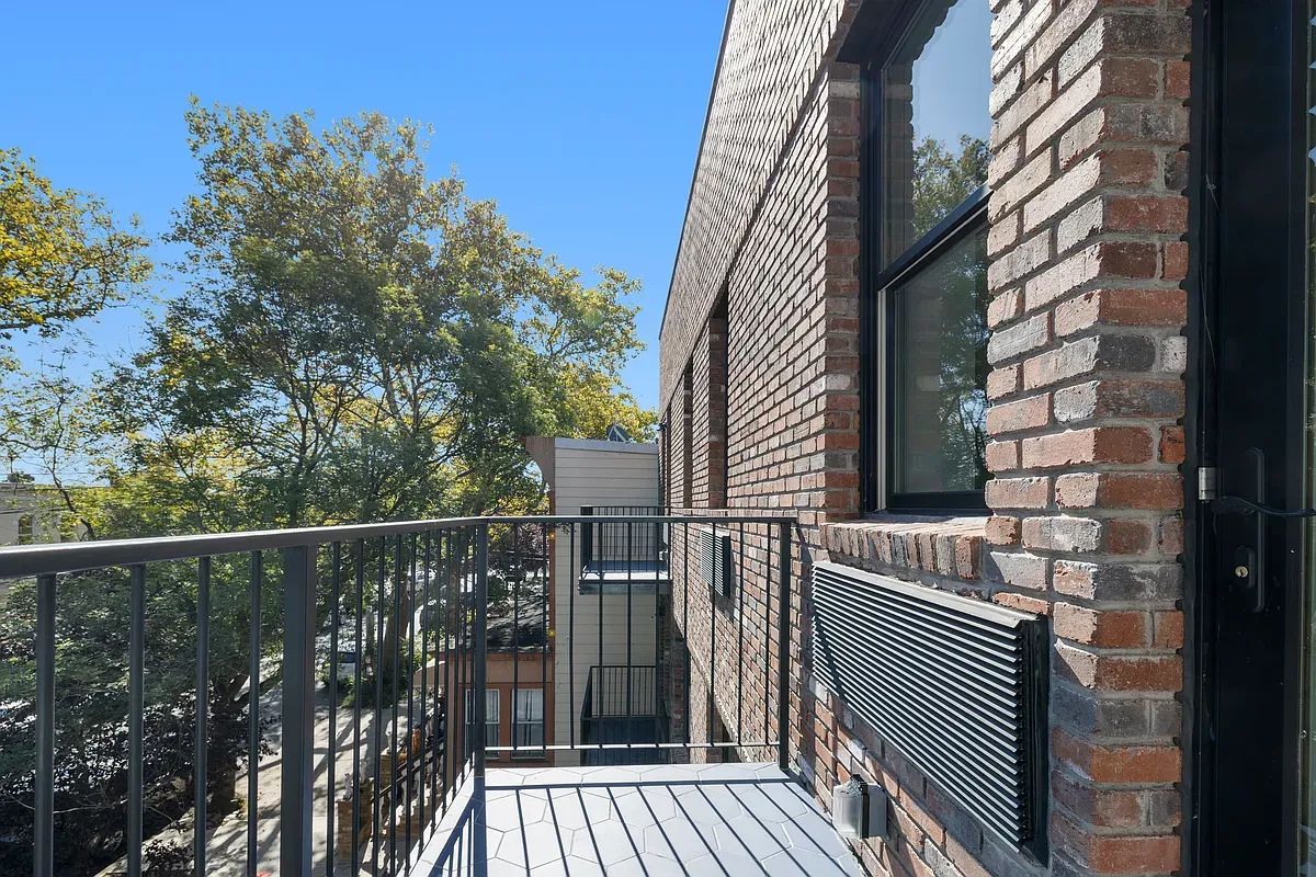 a view of balcony and wooden floor