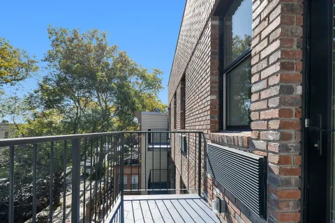 a view of balcony and wooden floor