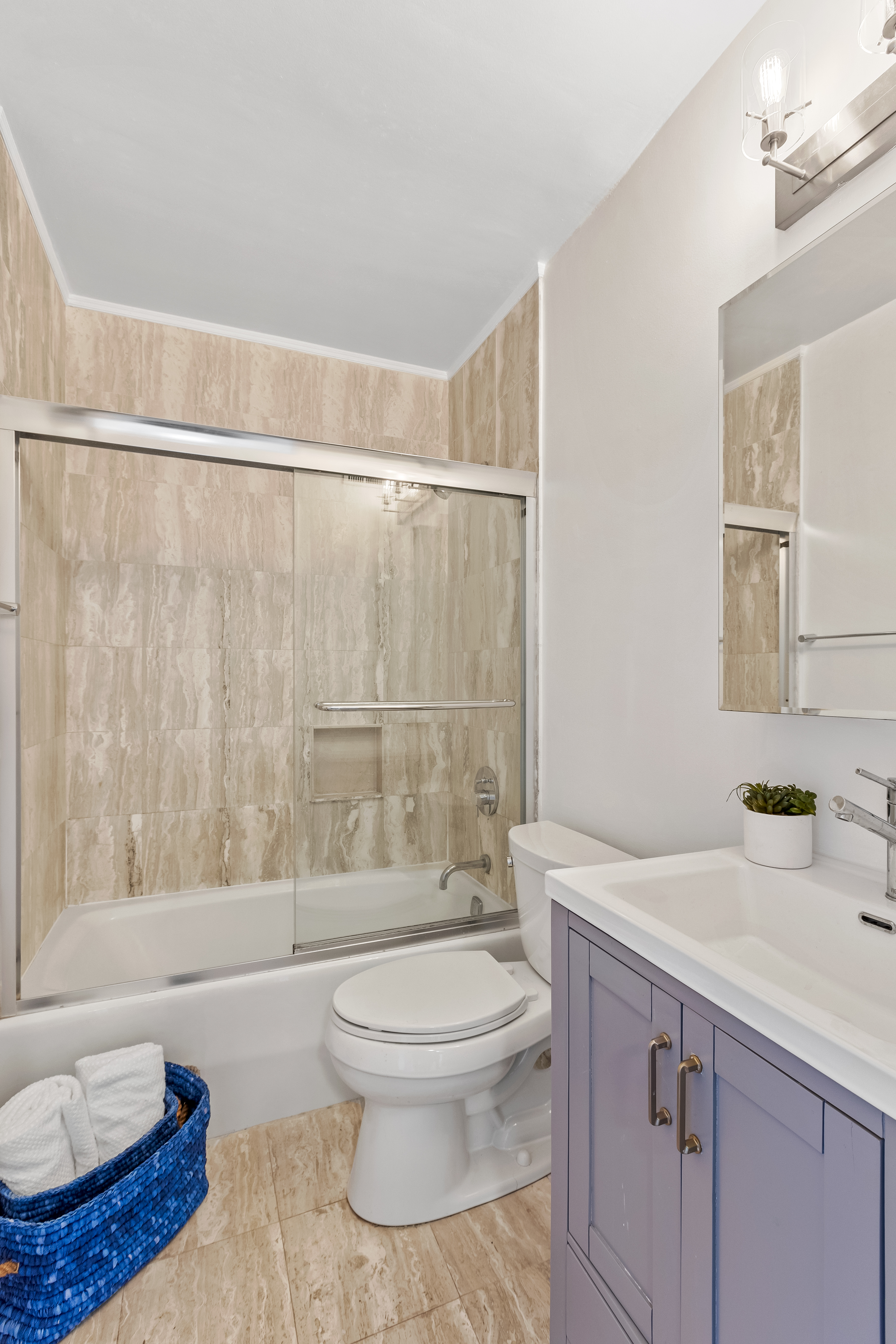 157 East 32nd Street, Unit 8A Manhattan, NY 10016 - Photo 10 of 16 a bathroom with a sink a toilet and shower