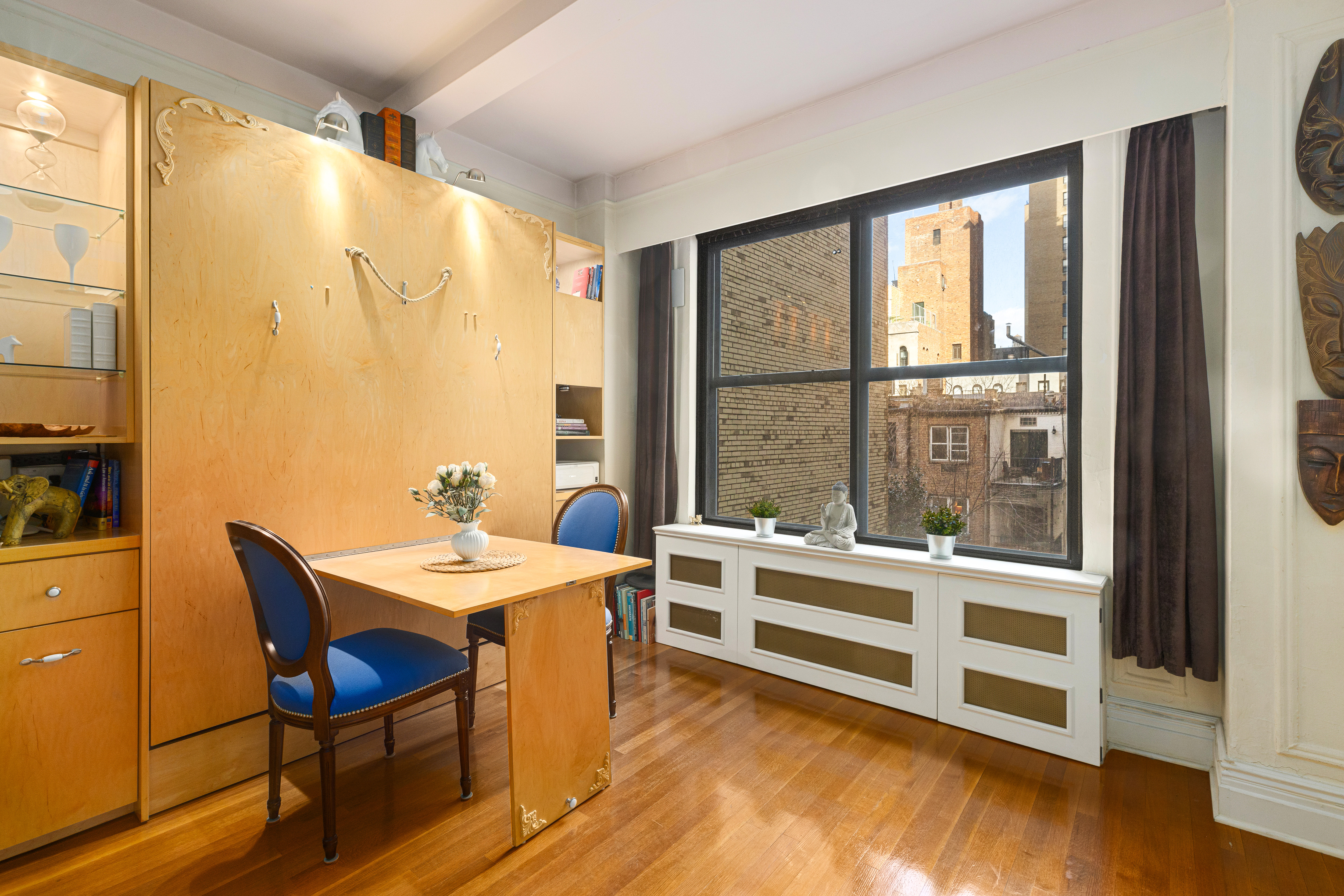 225 Central Park West, Unit 416 Manhattan, NY 10024 - Photo 4 of 16 a view of a workspace with furniture and window