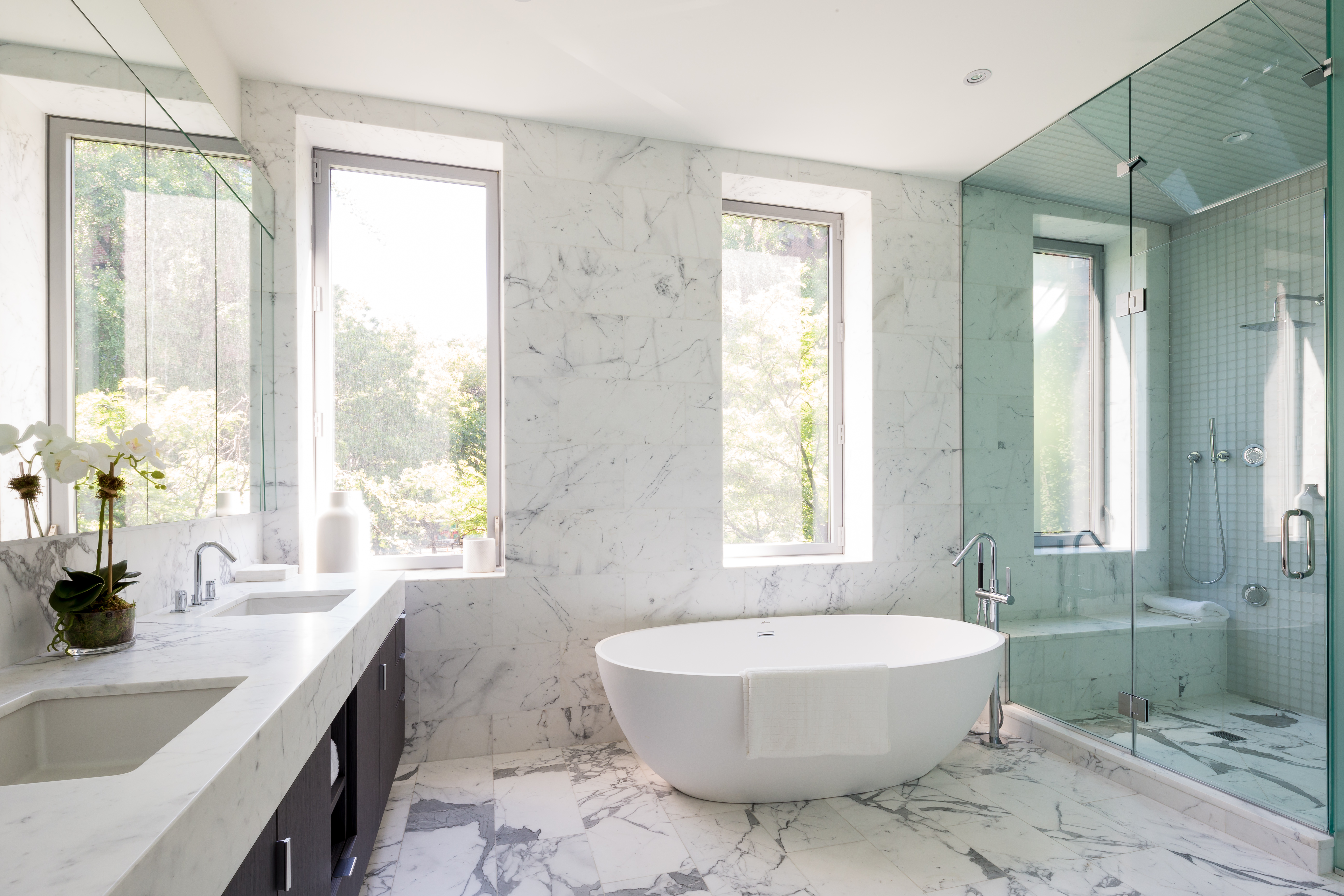 450 West 25th Street Manhattan, NY 10001 - Photo 12 of 16 a bathroom with a granite countertop sink and mirror with bathtub