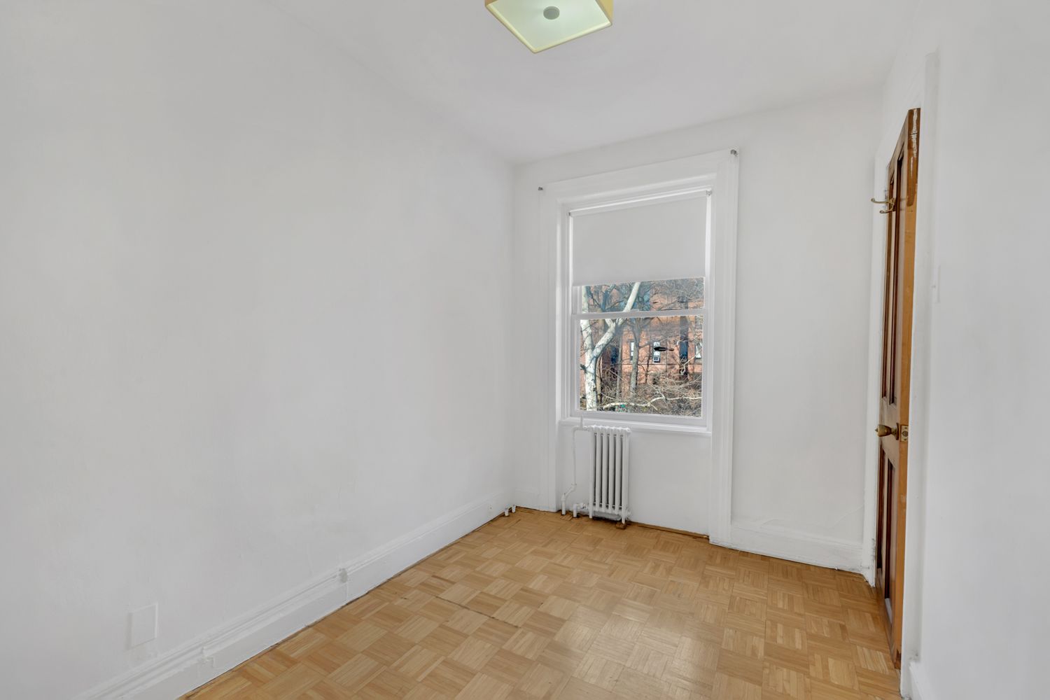 48 Livingston Street, Unit 3F Brooklyn, NY 11201 - Photo 5 of 11 a view of an empty room with window and closet area