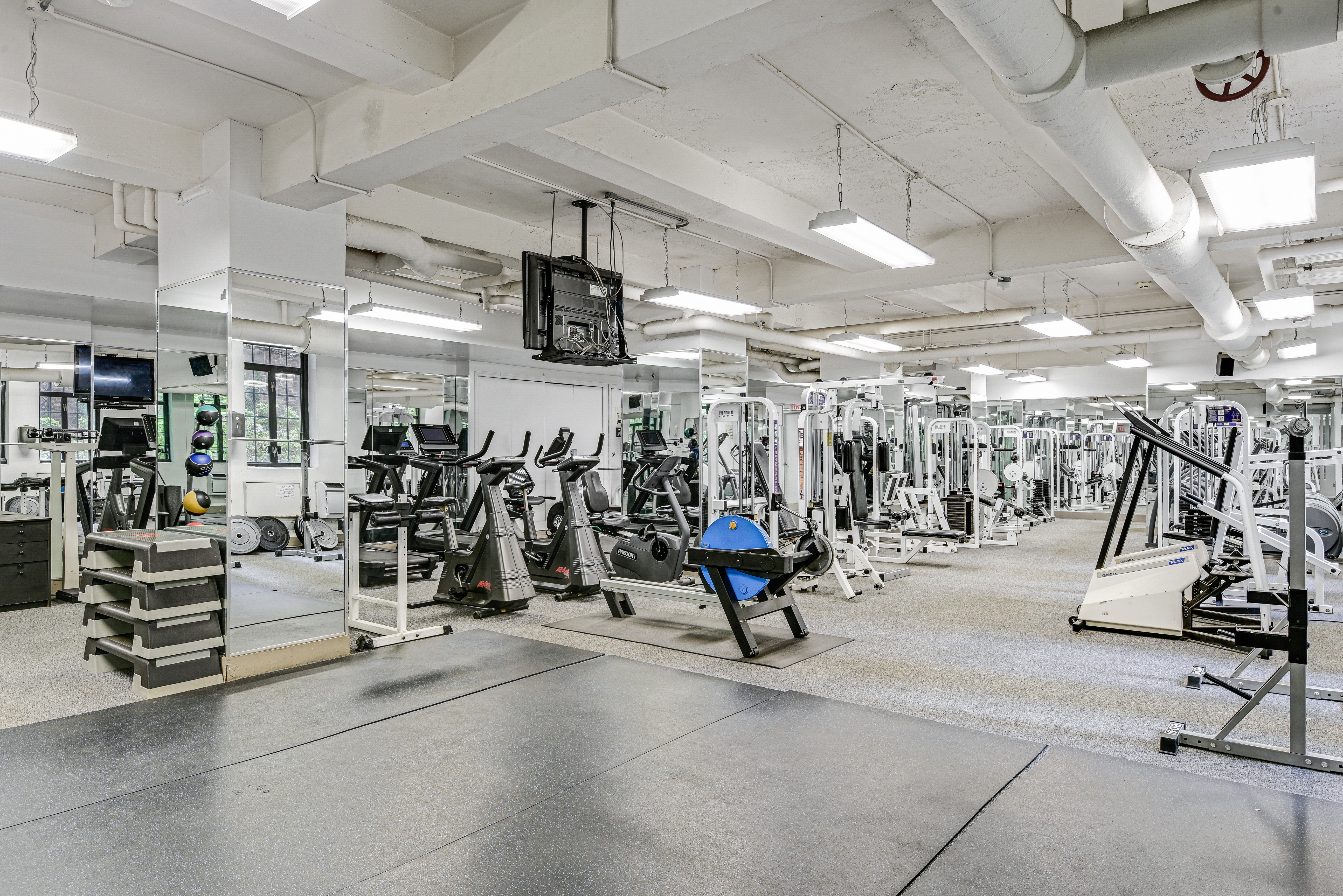 320 East 42nd Street, Unit 2510 Manhattan, NY 10017 - Photo 13 of 14 a view of a room with gym equipment