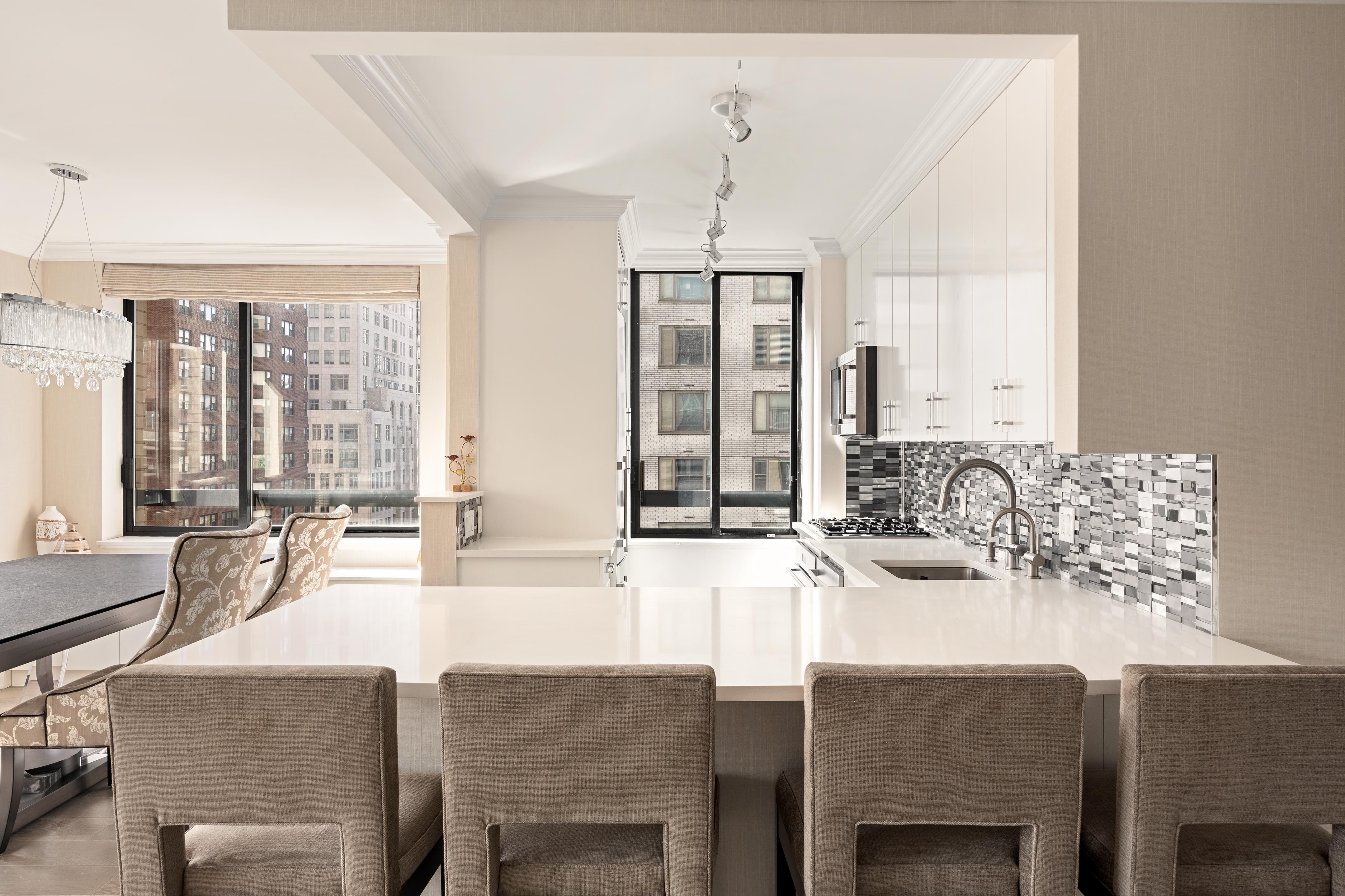 171 East 84th Street, Unit 7B Manhattan, NY 10028 - Photo 3 of 19 a dining room with furniture and large windows