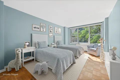 a bed room with a bed and a chair