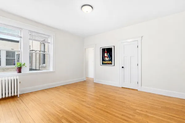 a bathroom with a sink a toilet and window