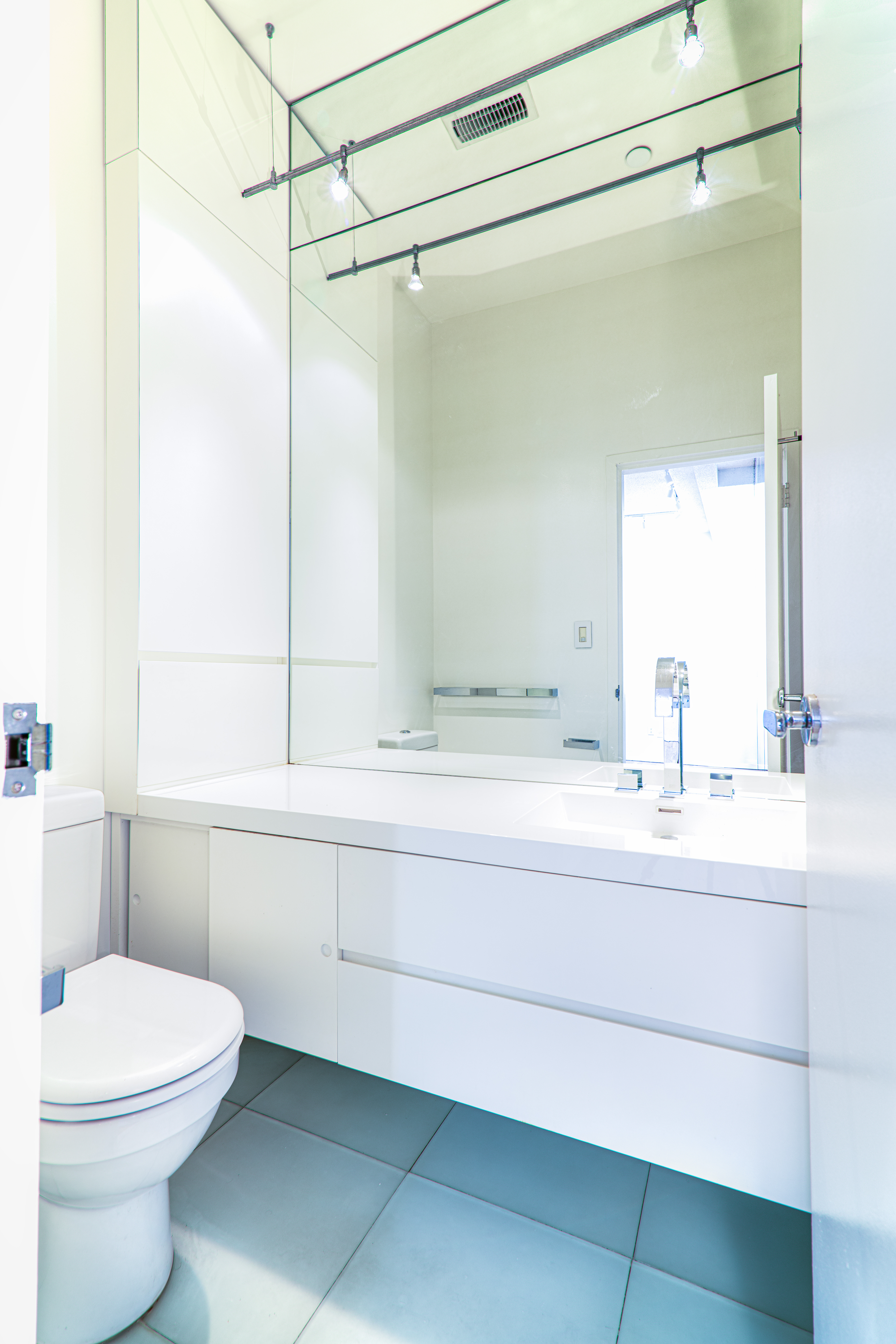 303 Mercer Street, Unit A601 Manhattan, NY 10003 - Photo 7 of 19 a bathroom with a sink a toilet and shower