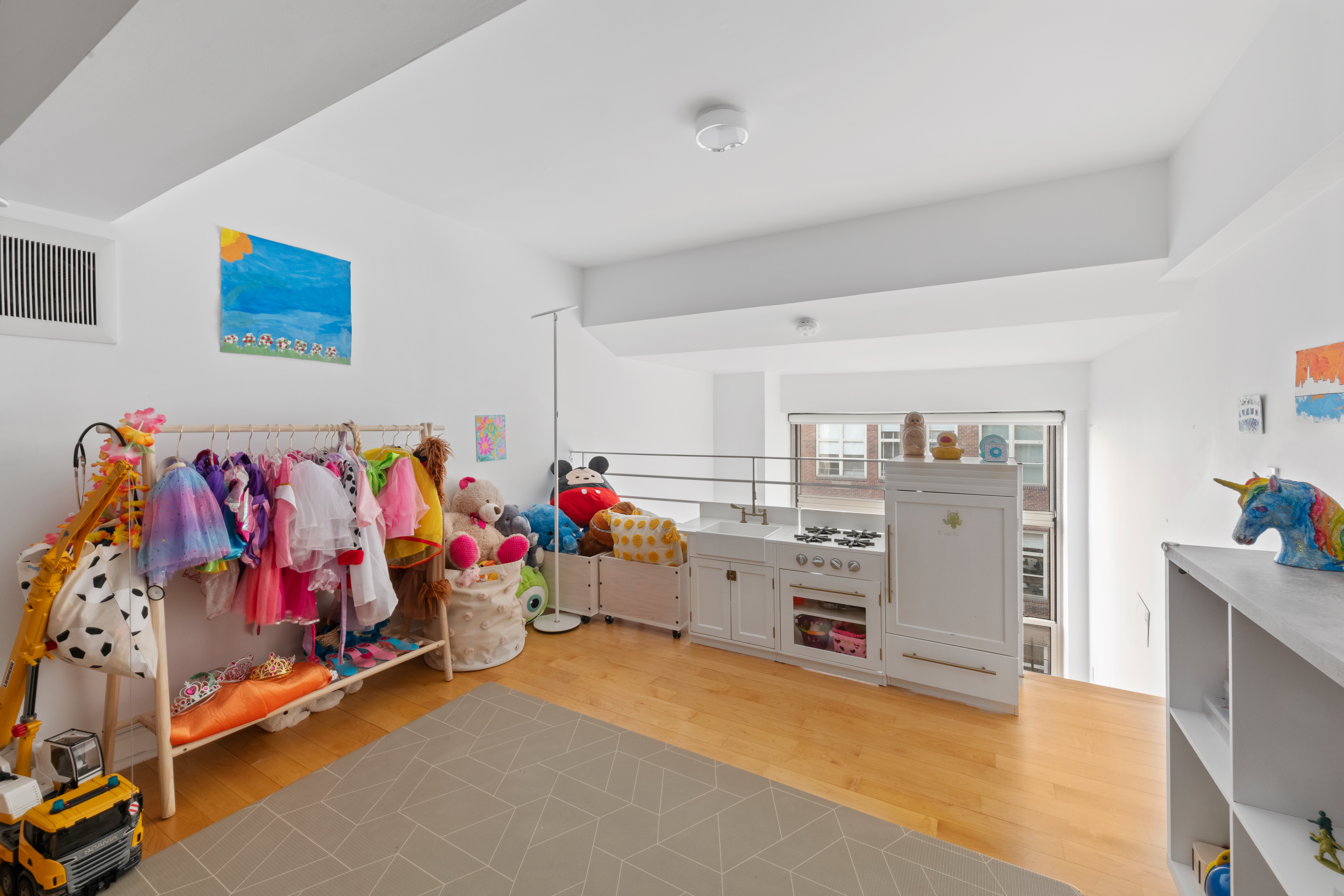 120 East 87th Street, Unit R16G Manhattan, NY 10128 - Photo 13 of 20 a view of a room with baby toys