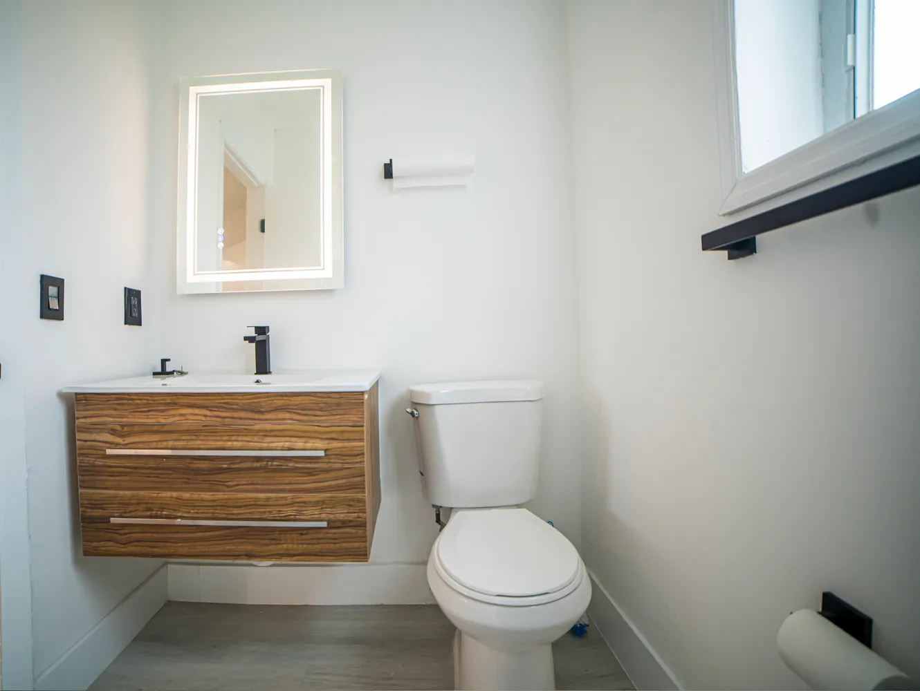 a bathroom with a toilet and a sink