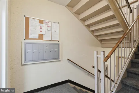 a view of staircase with wooden floor