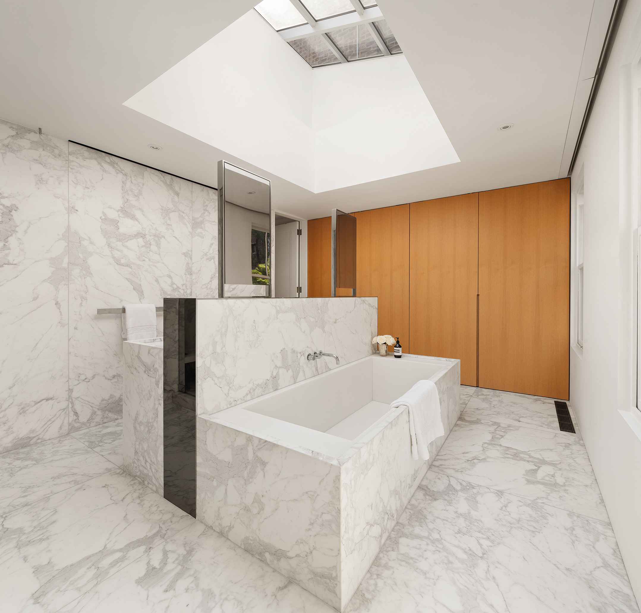 55 West 9th Street Manhattan, NY 10011 - Photo 17 of 20 a bathroom with a tub sink and mirror