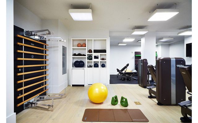 404 Park Avenue South, Unit 5B Manhattan, NY 10016 - Photo 13 of 16 a living room with furniture and gym equipment
