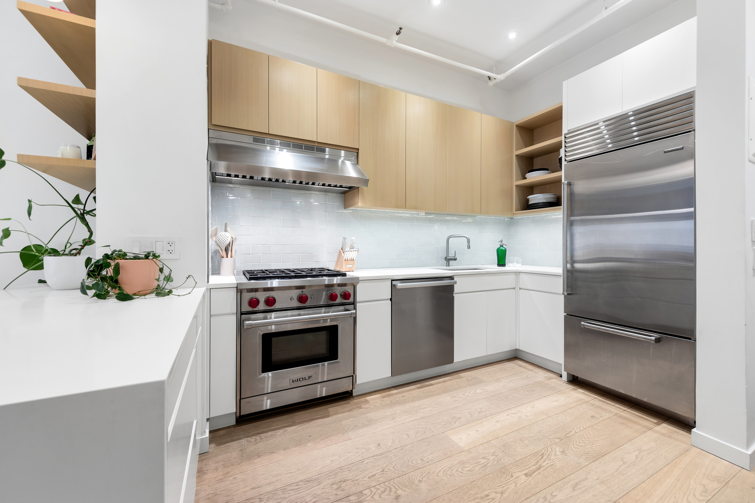 808 Broadway, Unit 4K Manhattan, NY 10003 - Photo 2 of 7 a kitchen with a stove refrigerator and a sink