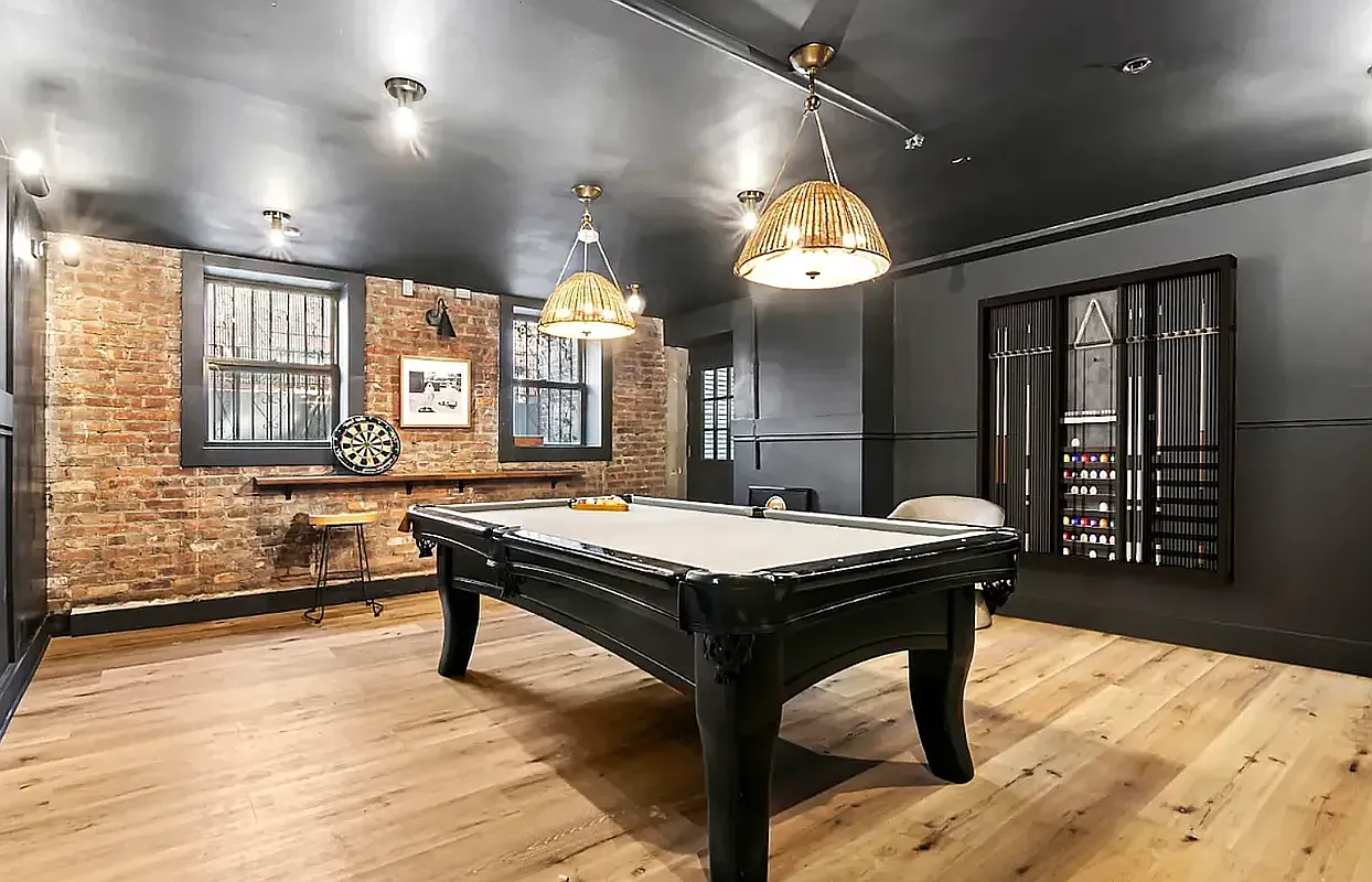 180 Bainbridge Street, Unit 211 Brooklyn, NY 11233 - Photo 15 of 21 a room with a table chairs and a chandelier