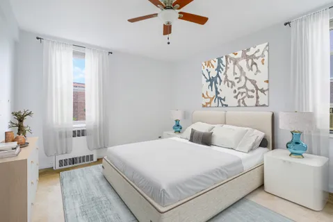 a bedroom with a bed and a couch