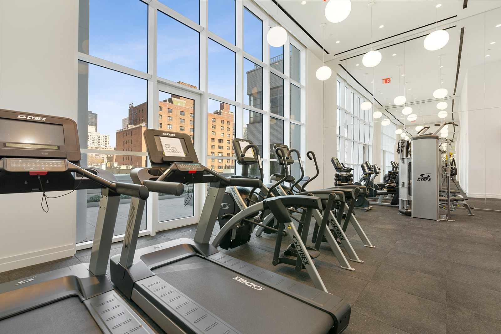 200 East 59th Street, Unit 11C Manhattan, NY 10022 - Photo 8 of 11 a view of a room with gym equipment