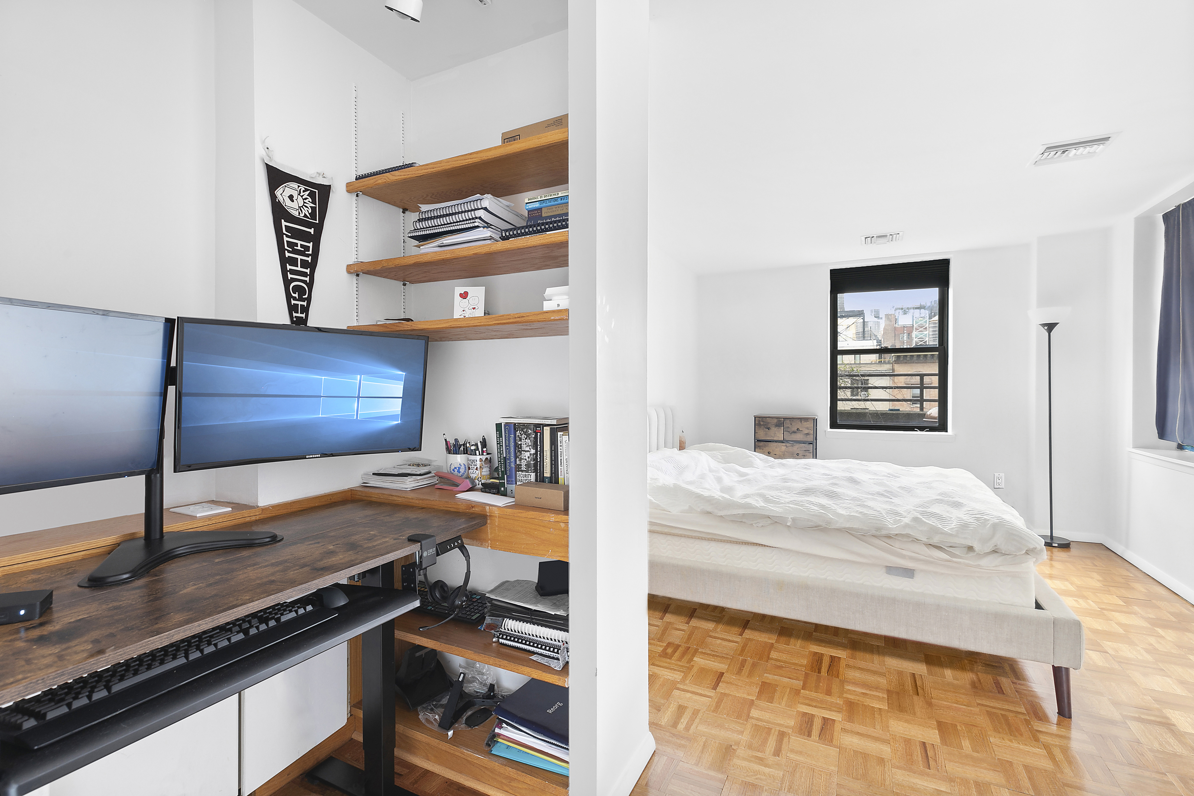 253 West 73rd Street, Unit 8G Manhattan, NY 10023 - Photo 4 of 5 a bedroom with a bed and a dresser with mirror