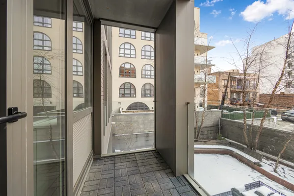 a bathroom with a shower and a sink