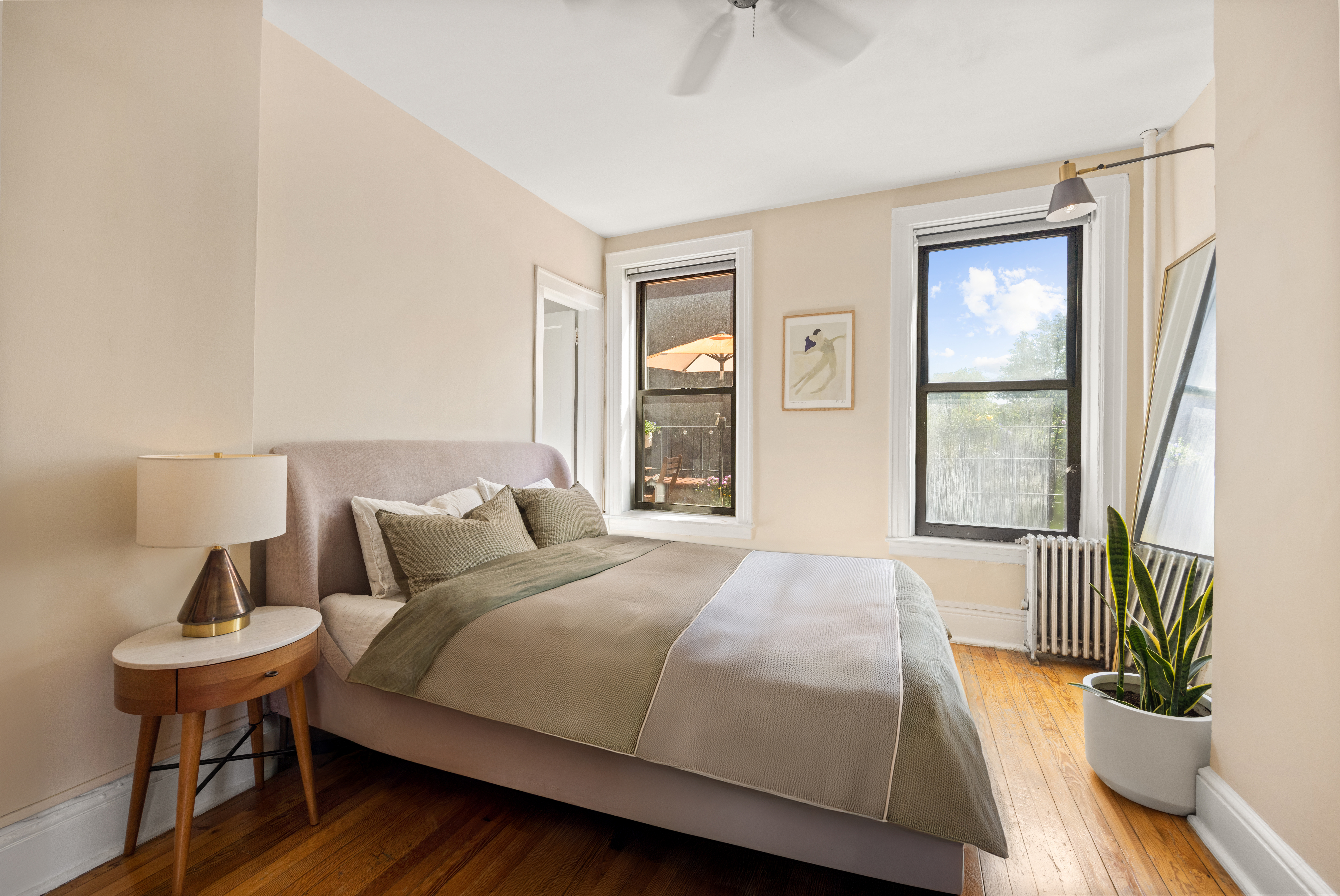 192-194 Union Street Brooklyn, NY 11231 - Photo 16 of 37 a bedroom with a bed and wooden floor