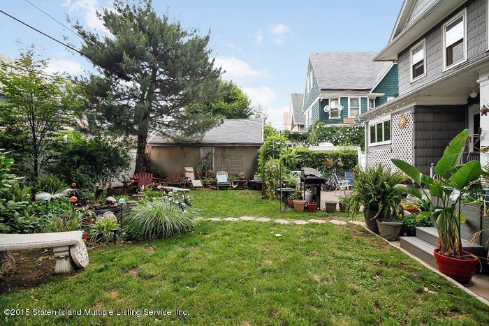 630 East 24th Street Brooklyn, NY 11210 - Photo 27 of 28 a view of backyard of house with outdoor seating and green space