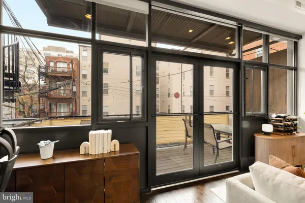 a view of a balcony with chairs