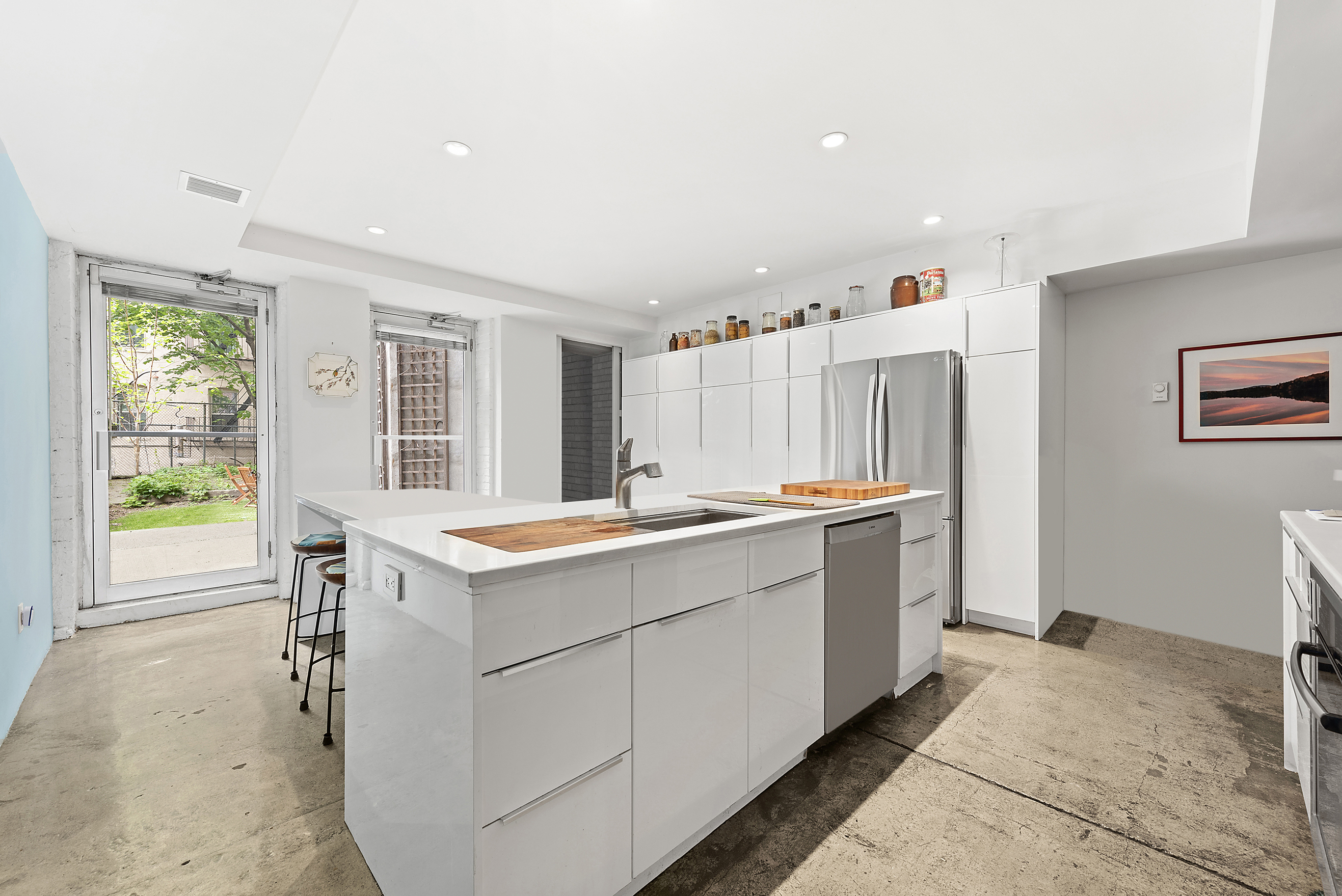 22 West 120th Street Manhattan, NY 10027 - Photo 18 of 21 a view of kitchen with windows and refrigerator