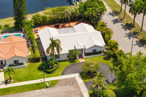 an aerial view of a house with a swimming pool