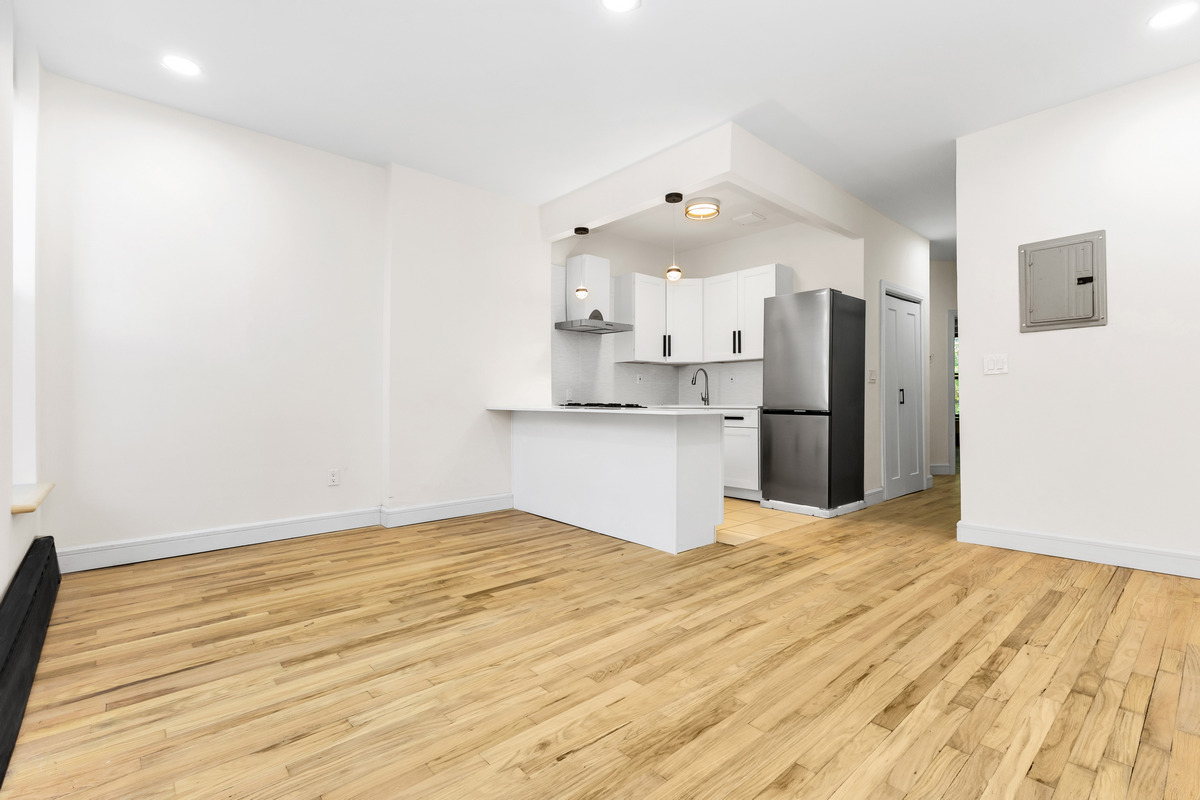 574 Gates Avenue Brooklyn, NY 11221 - Photo 4 of 16 a view of kitchen with wooden floor
