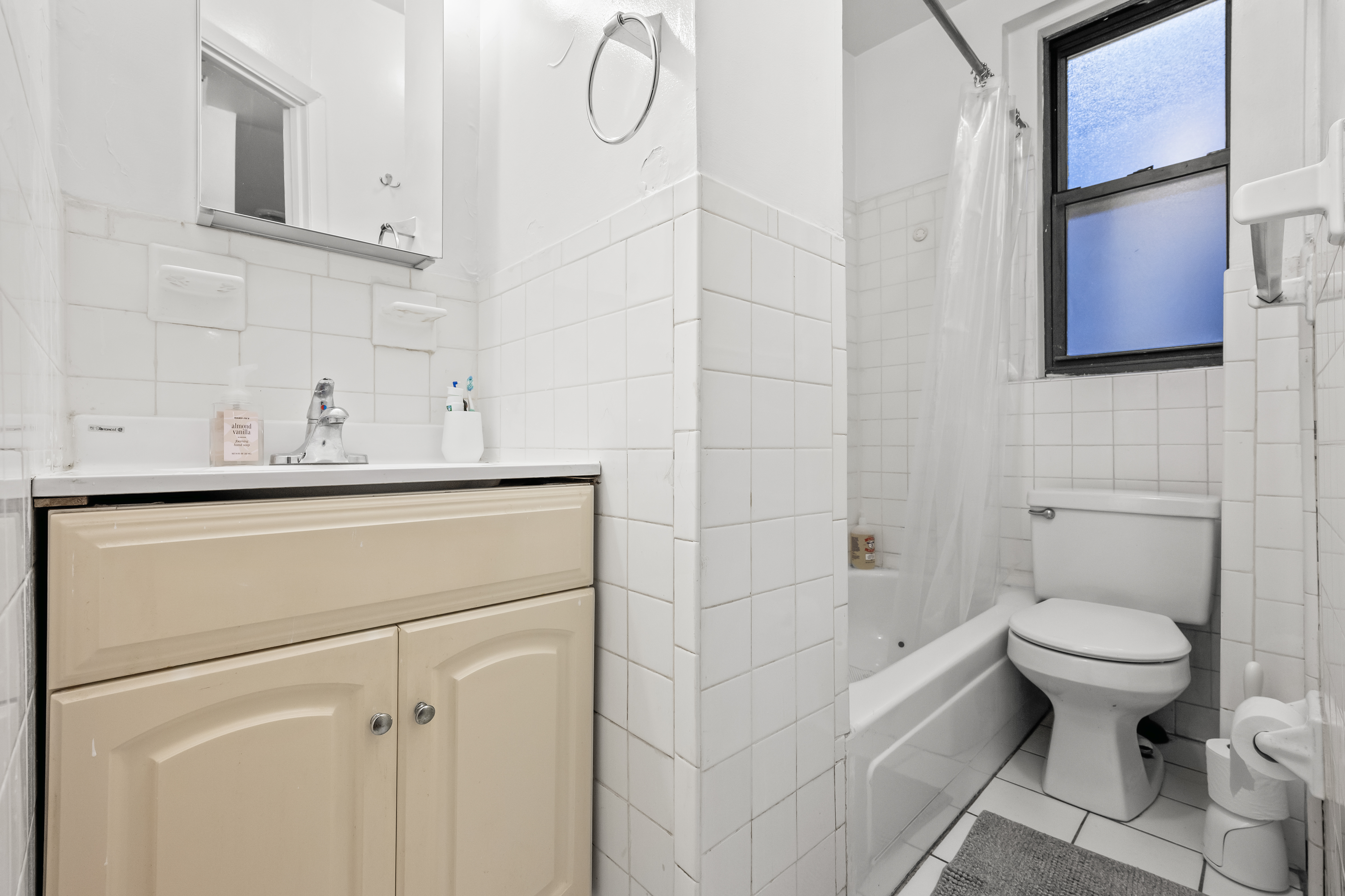 204 West 10th Street, Unit 7A Manhattan, NY 10014 - Photo 13 of 17 a bathroom with a sink toilet and shower