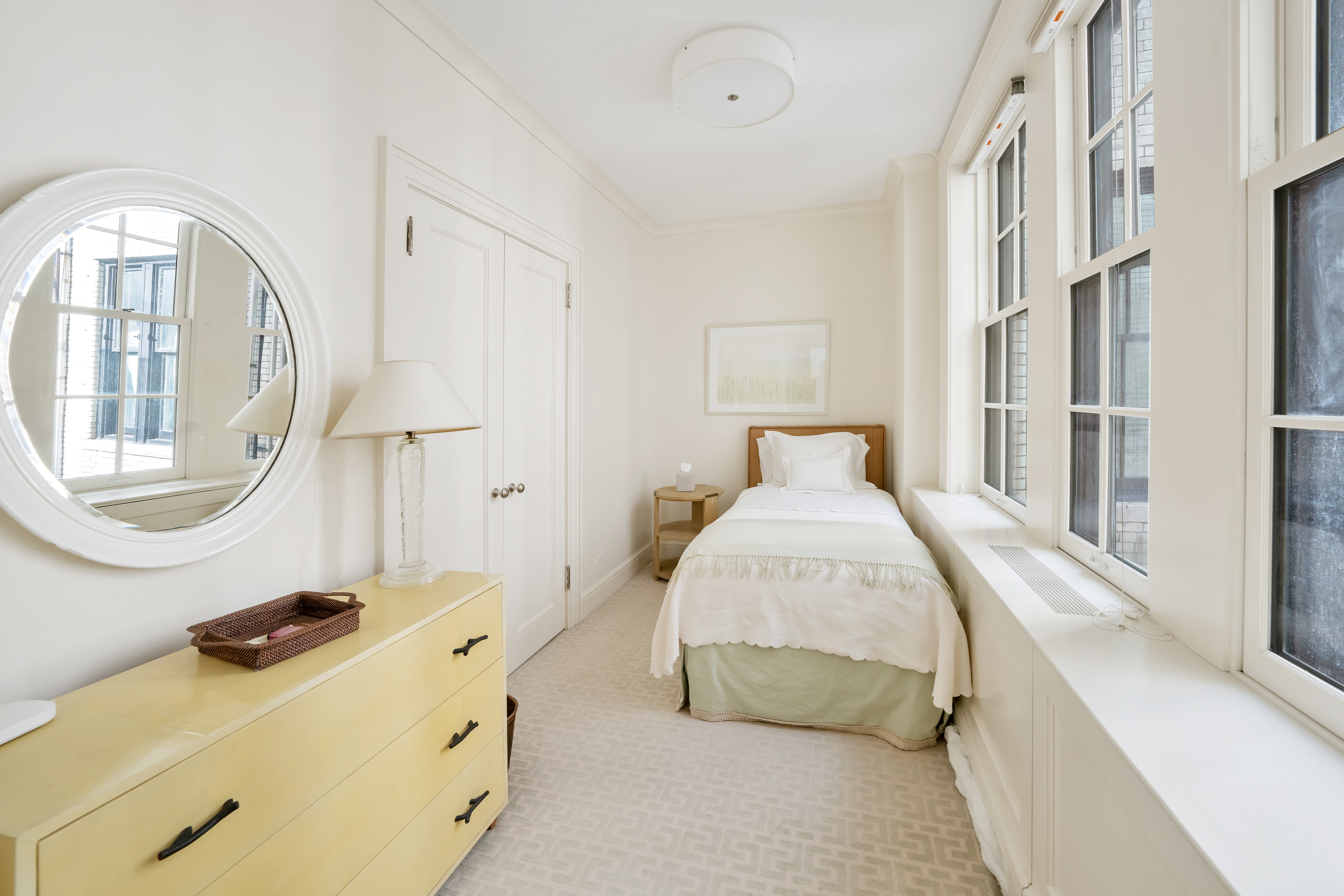 850 Park Avenue, Unit 9C Manhattan, NY 10075 - Photo 13 of 14 a bedroom with a bed and a mirror