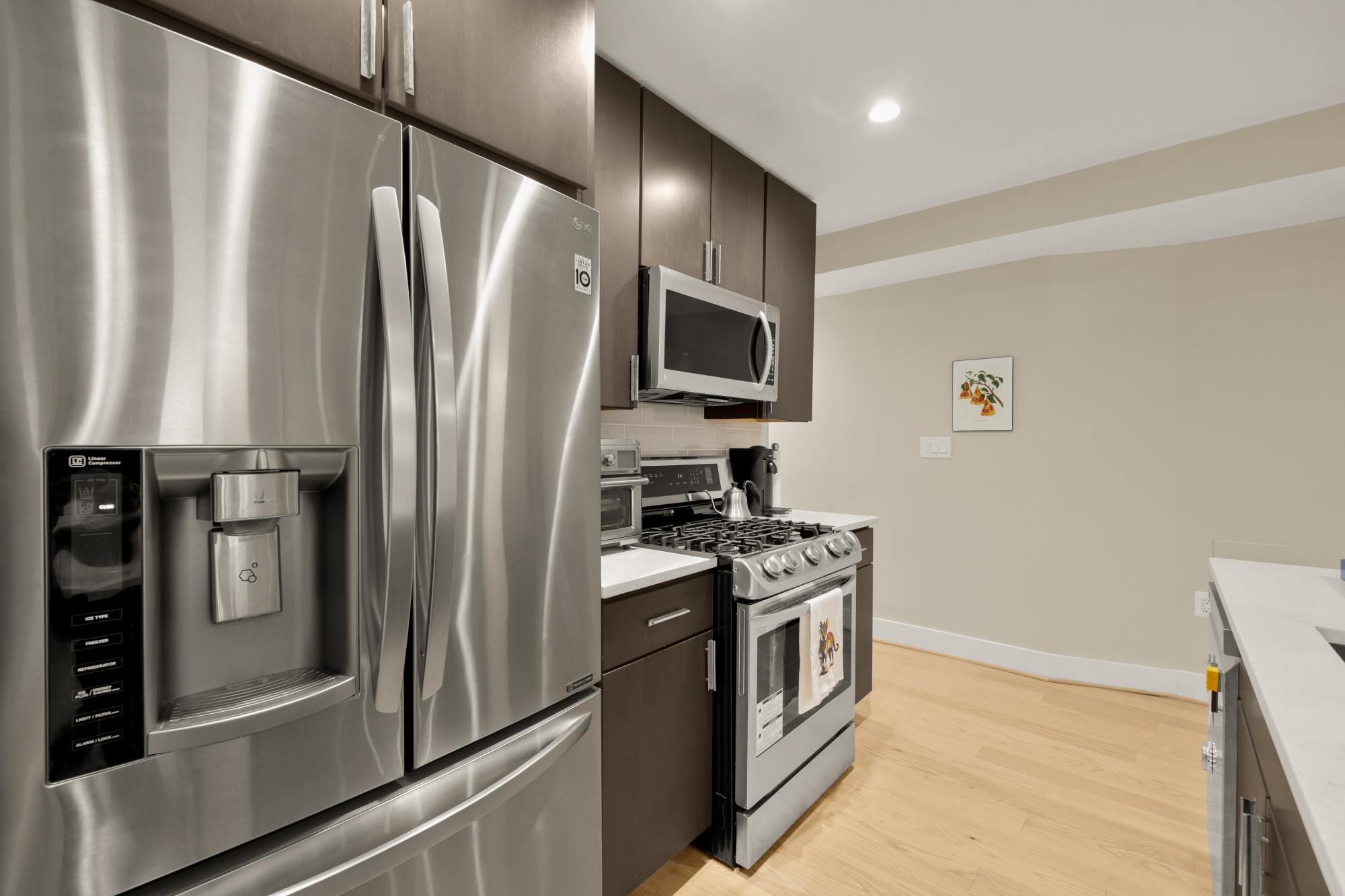 14 T Street Northeast, Unit 1 Washington, DC 20002 - Photo 18 of 39 a kitchen with stainless steel appliances granite countertop a refrigerator a stove and a sink