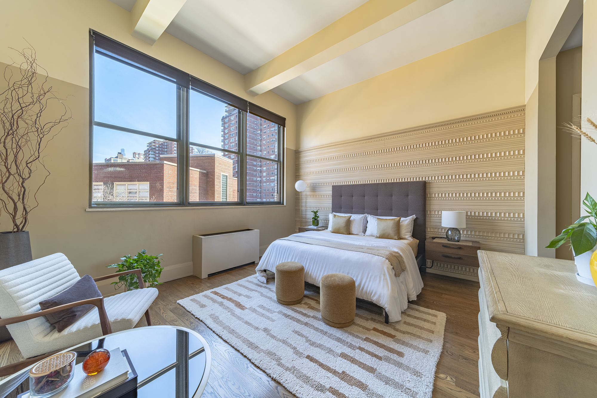 263 9th Avenue, Unit 3E Manhattan, NY 10001 - Photo 7 of 17 a bedroom with a bed table and chair