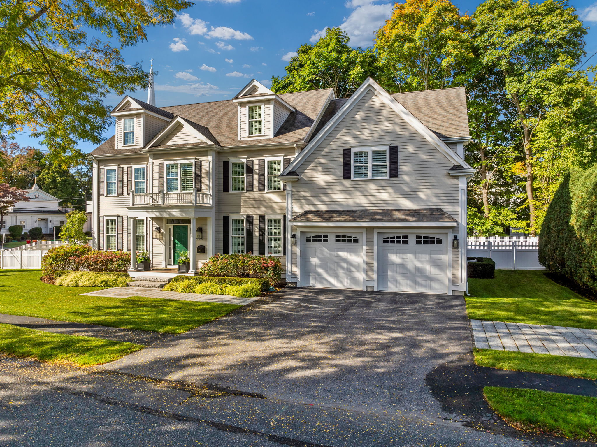 45 Washburn Avenue Needham, MA 02492 - Photo 1 of 23 a front view of a house with a garden and trees