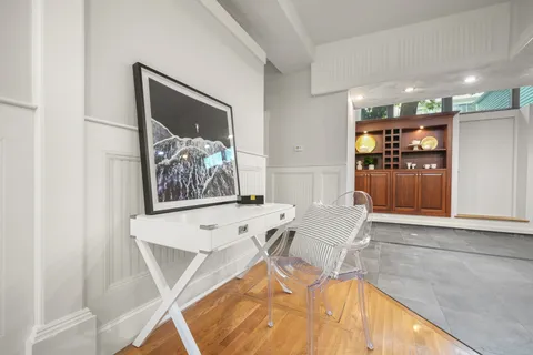 a living room with furniture and white walls