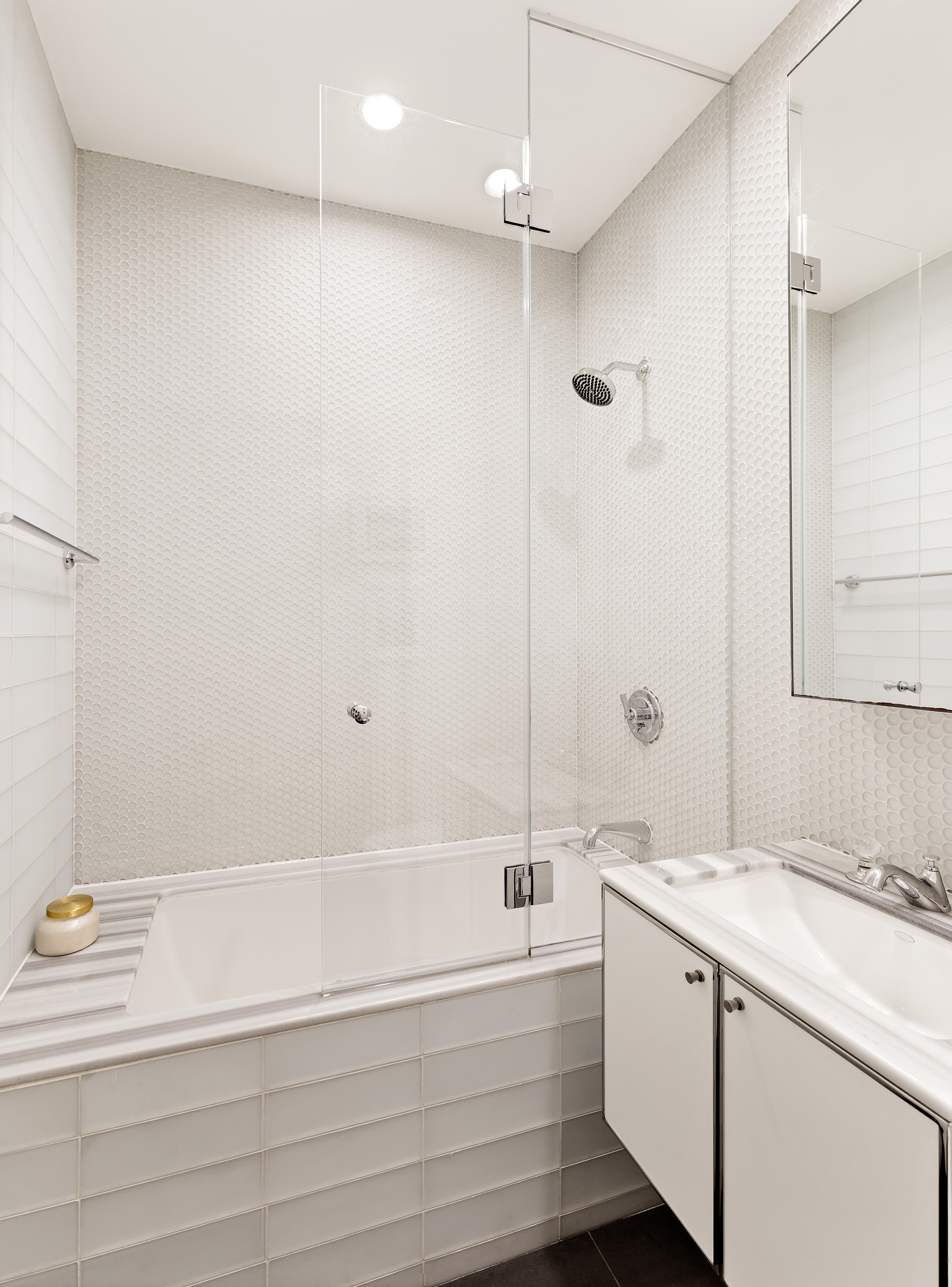 25 Broad Street, Unit 6T Manhattan, NY 10004 - Photo 5 of 13 a bathroom with a bathtub and a sink