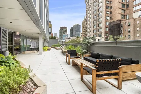 a view of terrace with seating area and barbeque oven