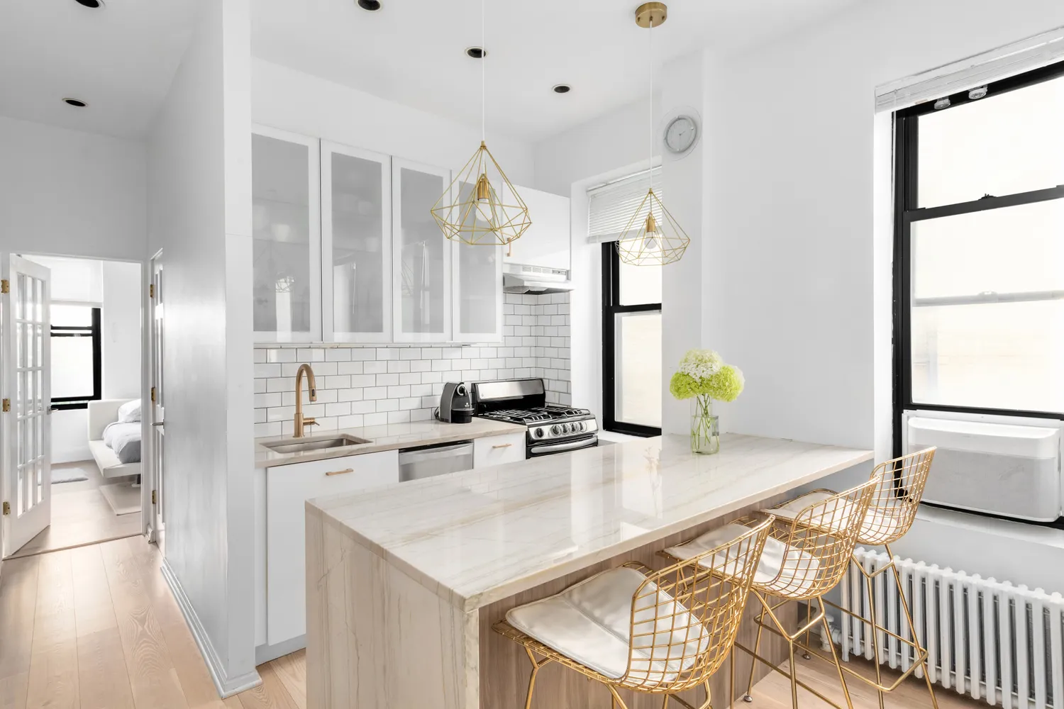 a kitchen with granite countertop a sink a stove and cabinets