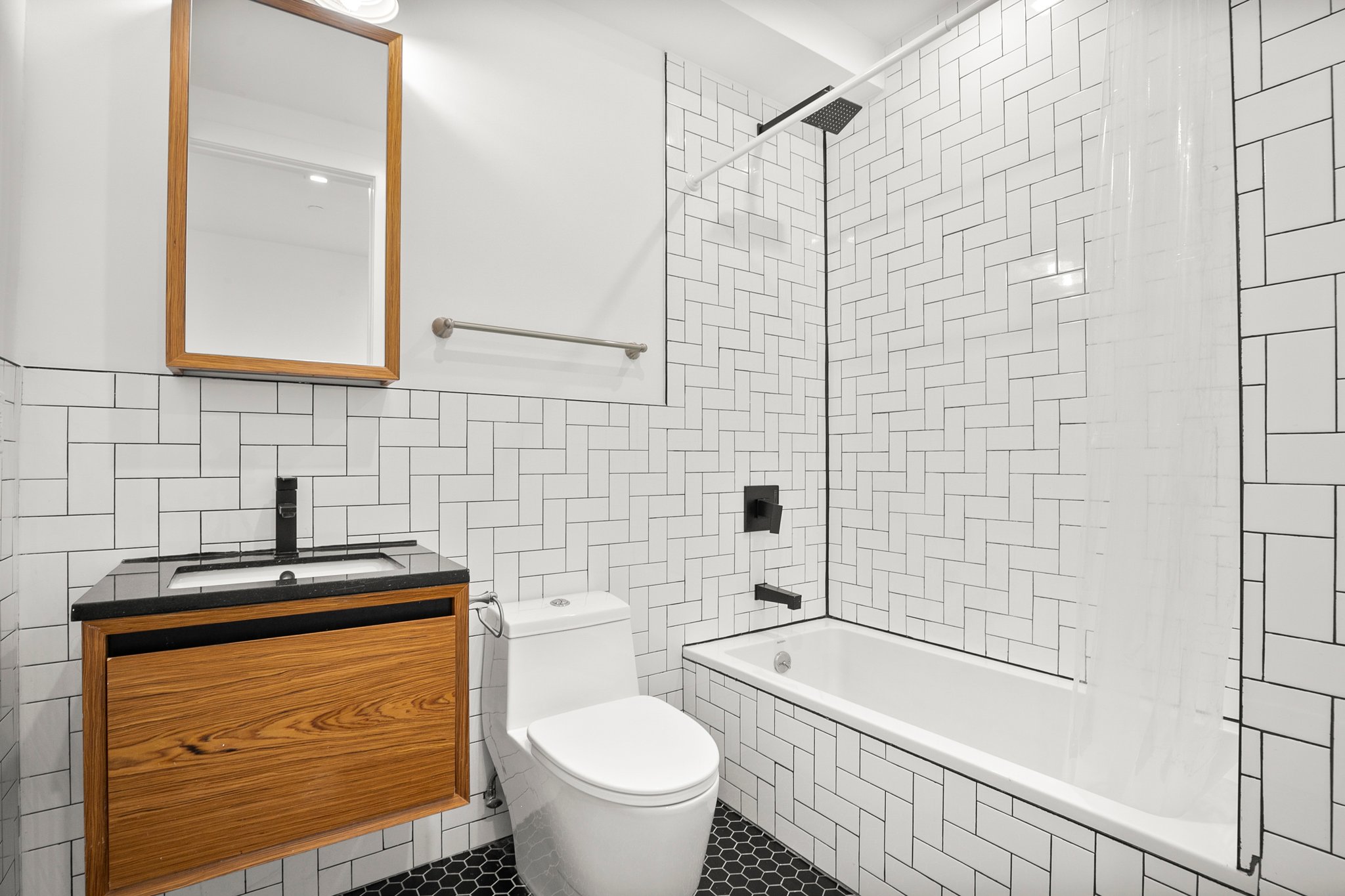 1130 Decatur Street Brooklyn, NY 11207 - Photo 7 of 24 a bathroom with a sink a toilet and shower