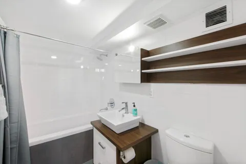 a picture of a bathroom with a sink