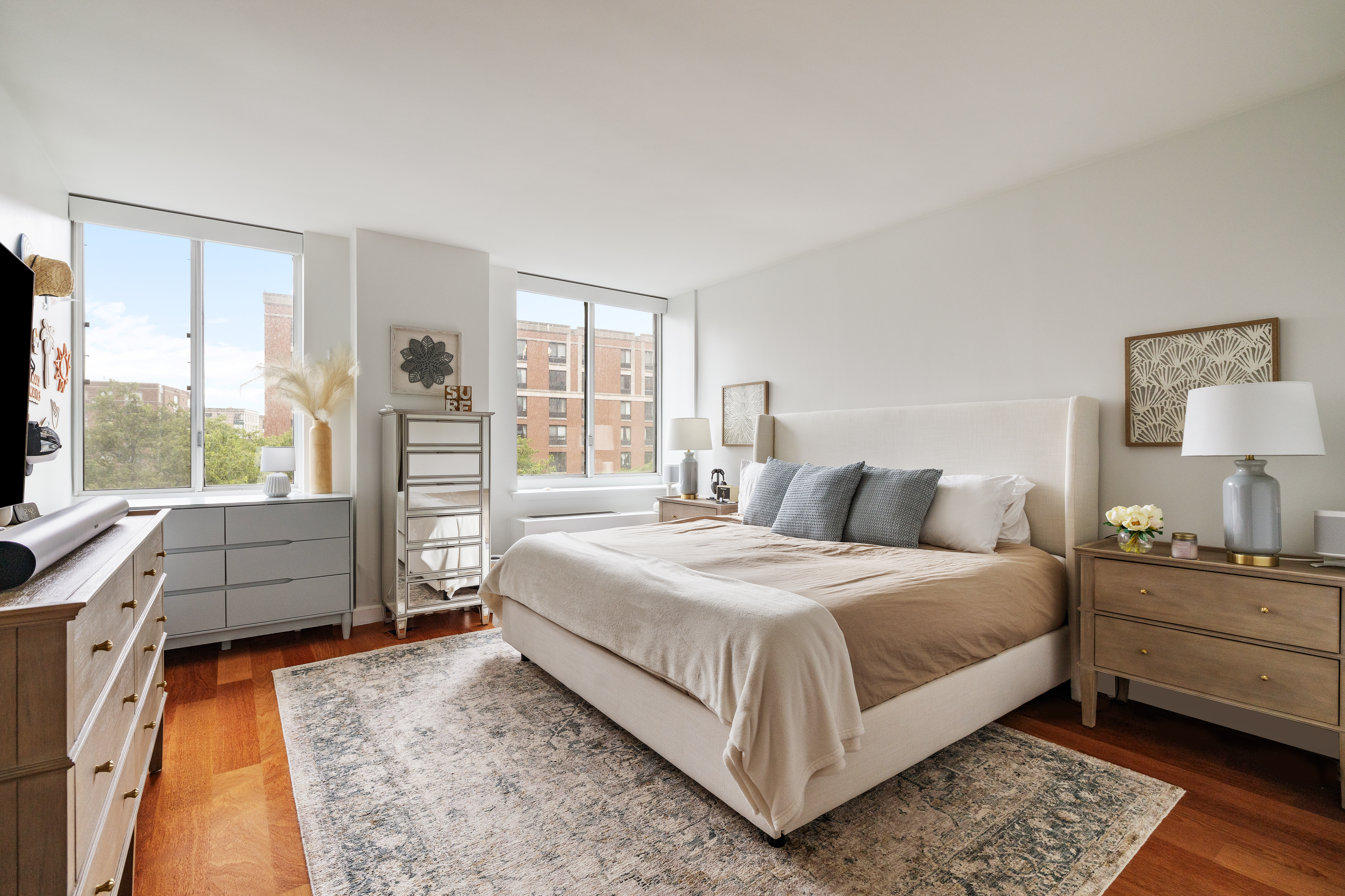 333 Rector Place, Unit 605 Manhattan, NY 10280 - Photo 4 of 13 a bedroom with a bed and large windows