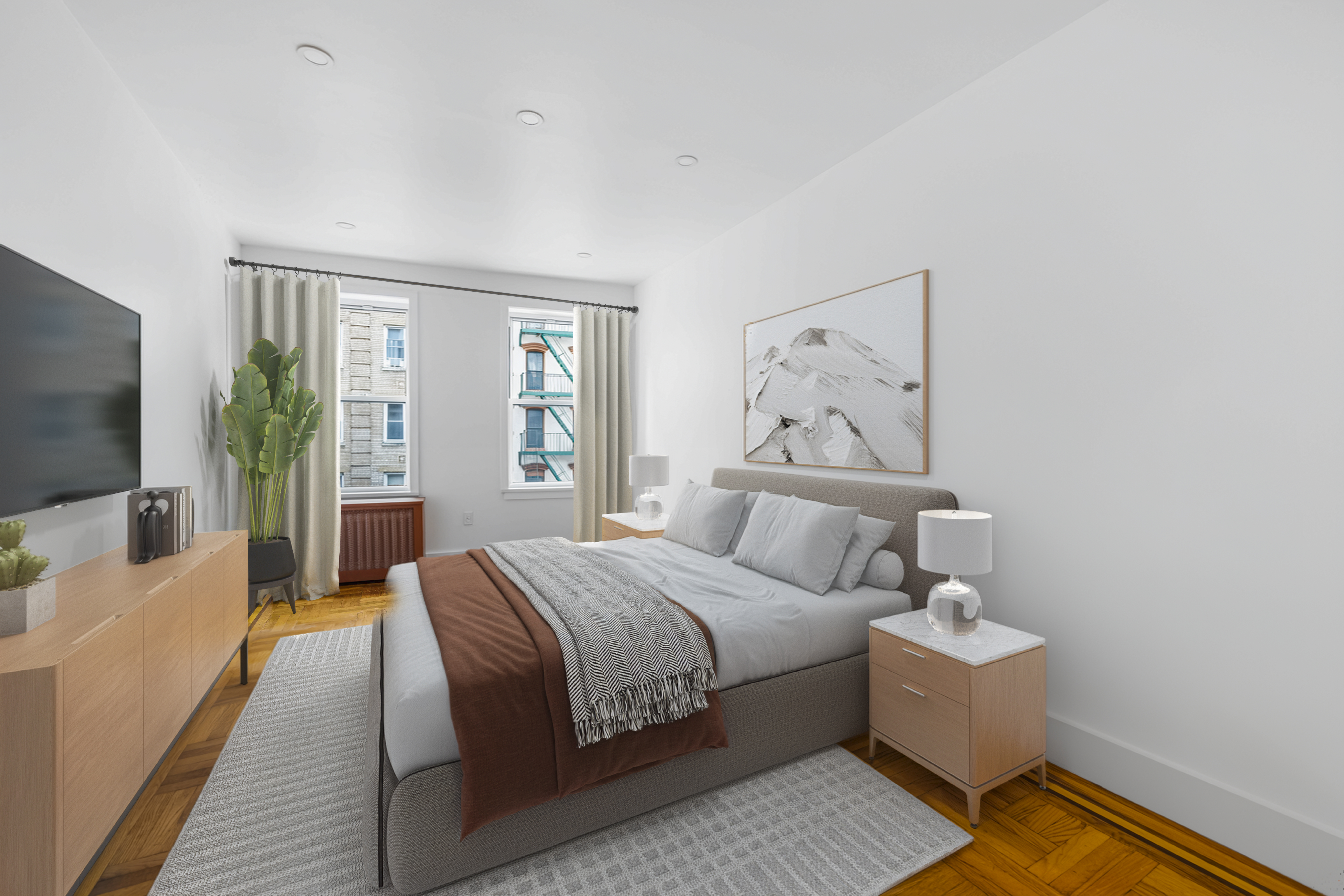 210 Grand Street, Unit 3F Manhattan, NY 10013 - Photo 3 of 11 a bedroom with a large bed and a flat screen tv